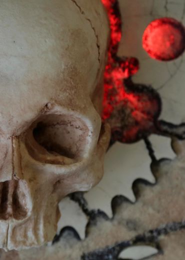 JOLLY WRENCHER fossil skull and wrenches cross bones. LED lighting and irregular edge.