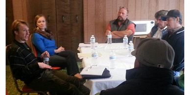 Bevin with the WA Latino Farmers Network, sitting around a table