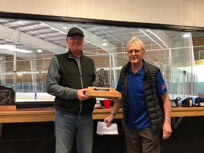Jan Goodhelpsen accepting ‘Buddy Noon’ Goaltender Award from Bob Turko.