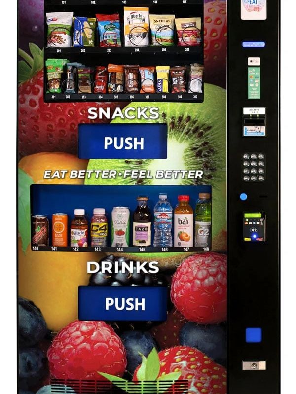 Healthy snack and drink vending machine with fruits background.
