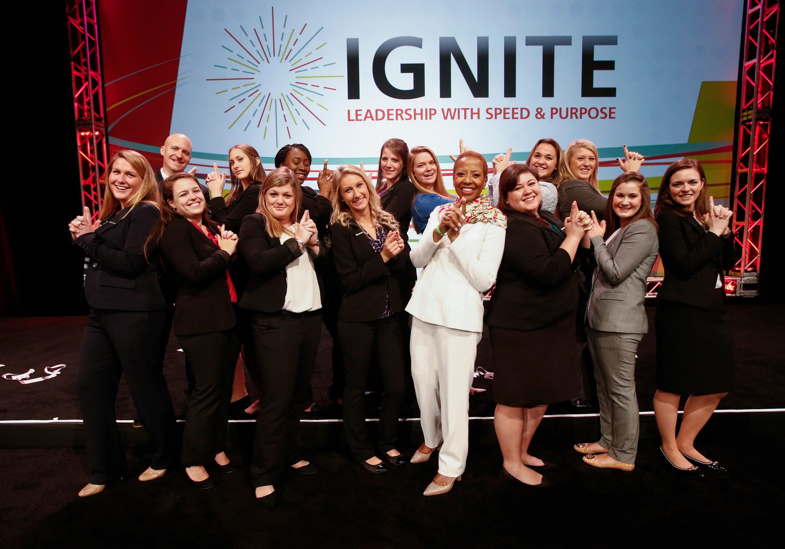Corporate event photography for a Dallas leadership conference with executive attendees and branding