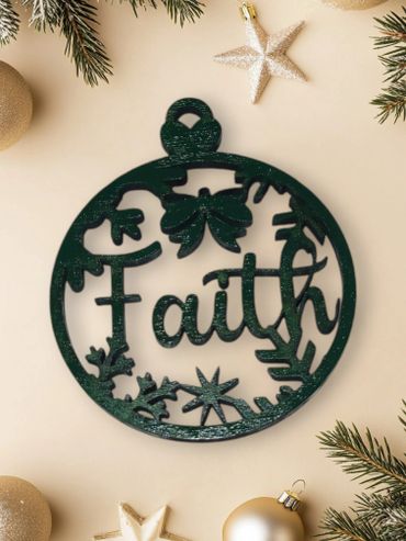 Dark green Christmas ornament with the word 'Faith' and festive decorations.