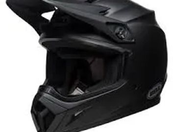 Black motocross helmet with visor and chin guard.