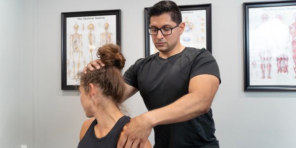 Lead Physiotherapist Richard providing trigger point release for neck and back pain - Whitby