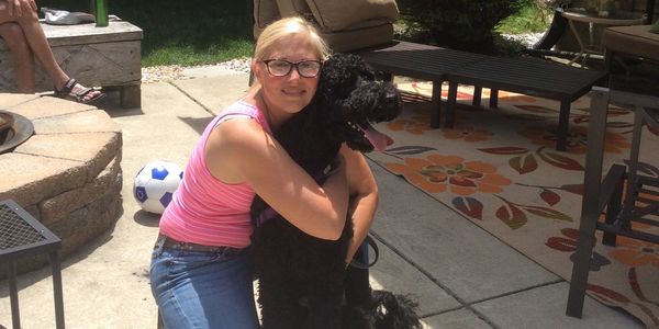 Heidi hugging dog during dog training