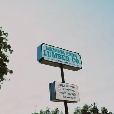 Building Materials and lumber signage at Nicoma Park Lumber displaying lumber yard near me in OKC