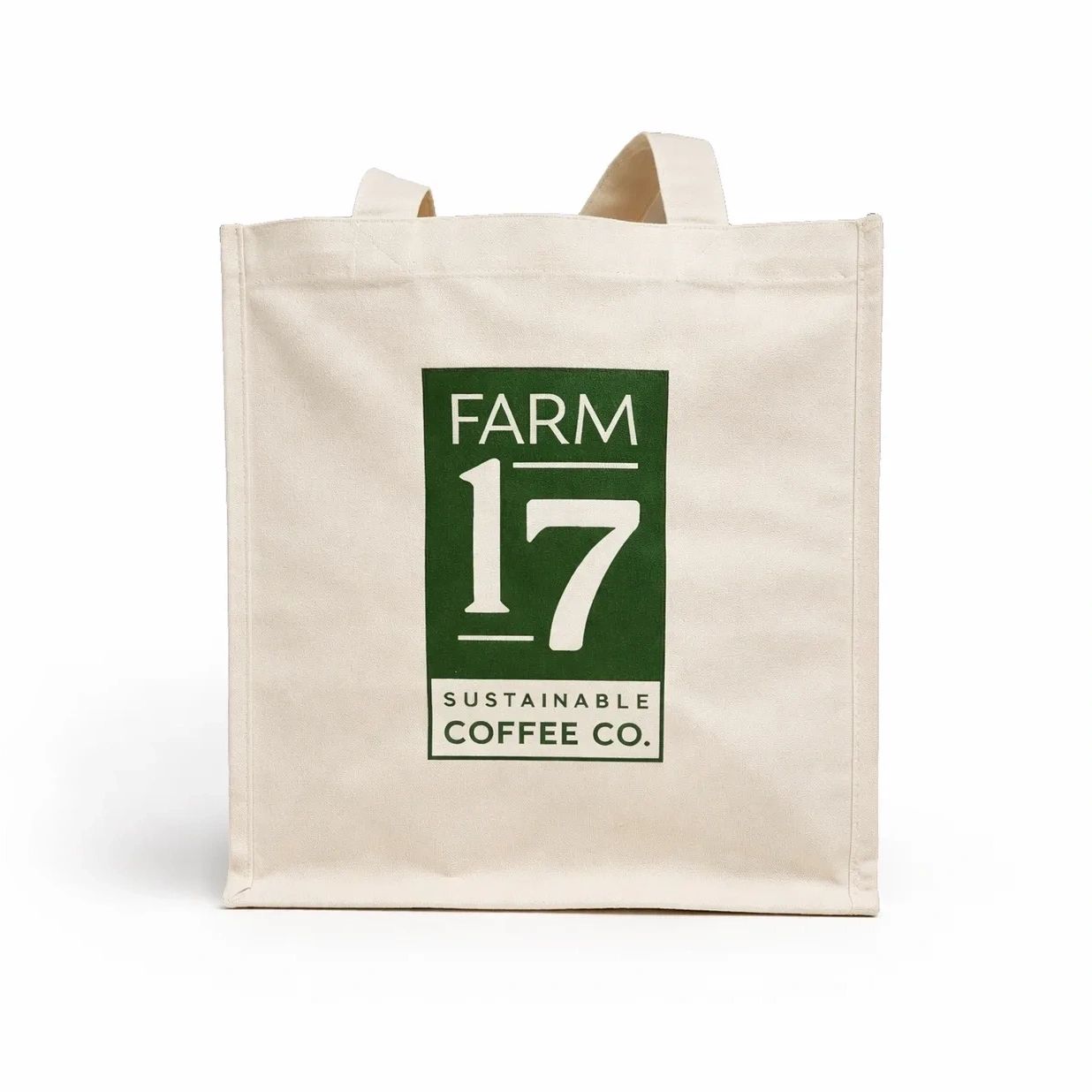Beige tote bag with green "Farm 17 Sustainable Coffee Co." logo.