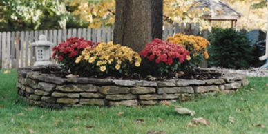 Stack rock flower beds, raised flower beds Mums, landscaping ideas DIY, D.I.Y. retaining walls