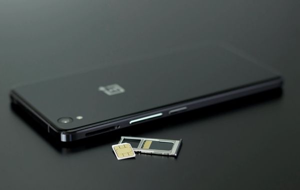 Sim card removed from smartphone laying on table