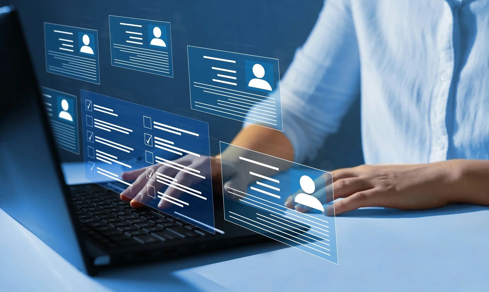 Person interacting with digital profiles on a laptop.