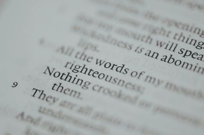 Close-up of a book page focusing on the words 'Nothing crooked in them.'