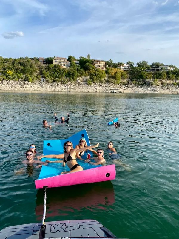 Fun day on Lake Travis with Jeramy’s party boat rentals, complete with lilly pad floating lounge