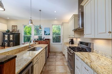 Kitchen with 36" gas stove and island