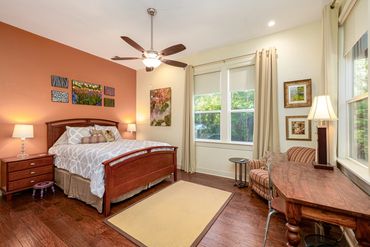 Bedroom with accent wall and drapery