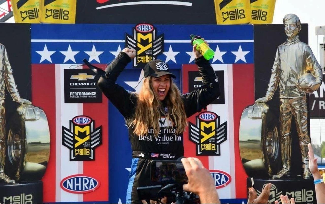 Ashley Sanford is ready to rock in Top Fuel competition – if only the NHRA could help Alan Johnson Racing, among other teams, close the corporate deals. (Photo courtesy of Ashley Sanford) Ashley Sanford is ready to rock in Top Fuel competition – if only the NHRA could help Alan Johnson Racing, among other teams, close the corporate deals. (Photo courtesy of Ashley Sanford)