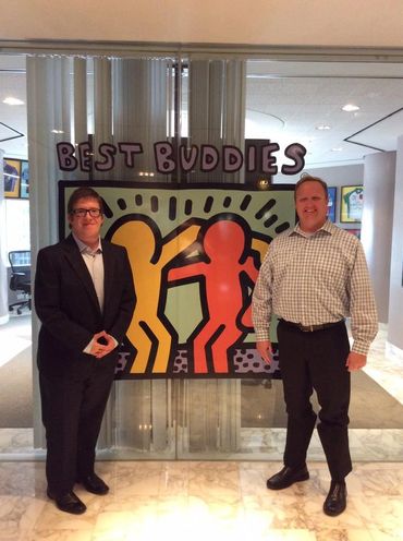 Dylan and David posing for a picture in front of Best Buddies Headquarters in Miami, FL.