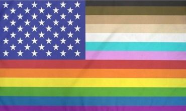 U.S. Progress Pride flag. Stripes from top represent race, followed by Trans Pride and Rainbow Pride