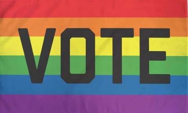 Rainbow Pride flag with the large caption "VOTE" in the center.