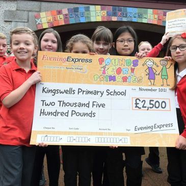 📷Pupils from Kingswells Primary School with their cheque for £2,500.