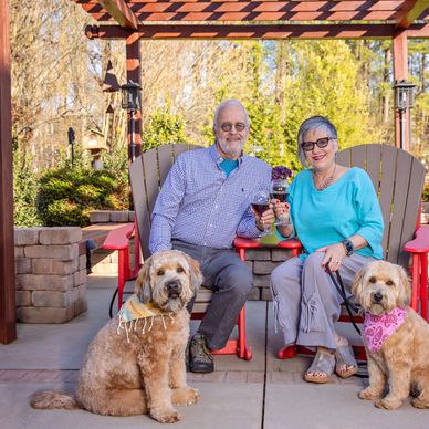 Peter and Karen Dortschy, with two of their three dogs, Tully and Jamie.
