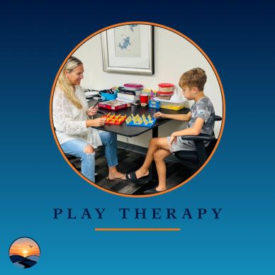 Therapist and child playing a board game during play therapy.