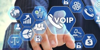 Finger pressing VOIP icon on futuristic screen.