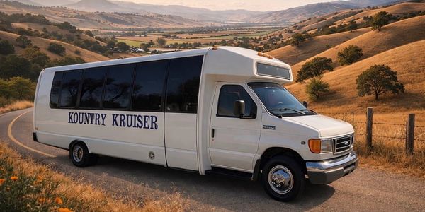 White Kountry Kruiser bus parked on a winding country road.