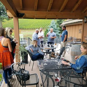 Wine tasting in Dundee Hills, guests enjoying the patio & outstanding Pinot Noir at DePonte Cellars