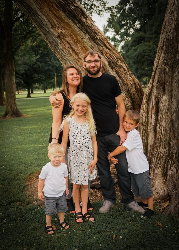 Family of 5 by a tree