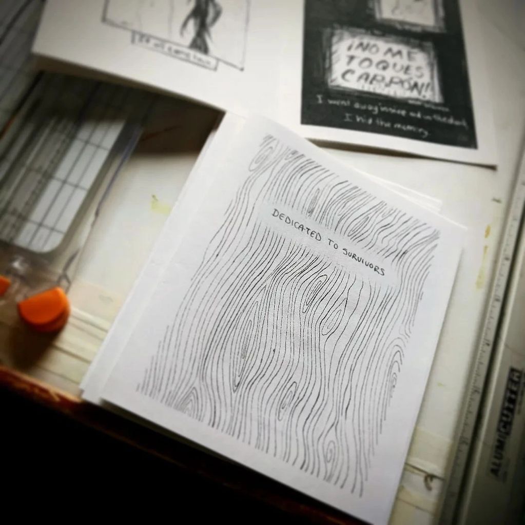 A black and white comic being made by hand.