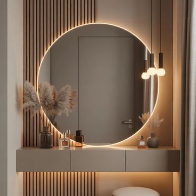 Modern vanity with a backlit round mirror and cozy stool.