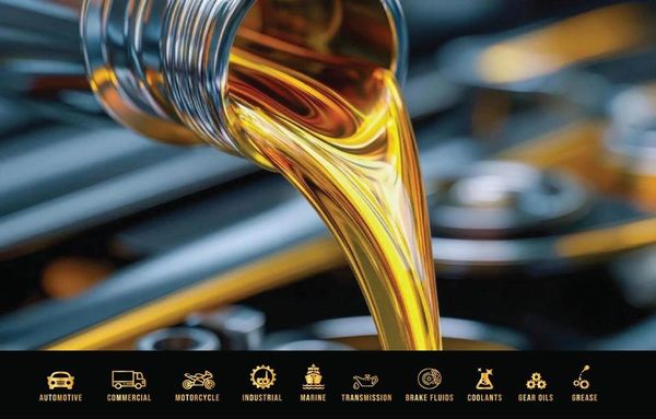 Golden motor oil being poured, highlighting various automotive fluids.