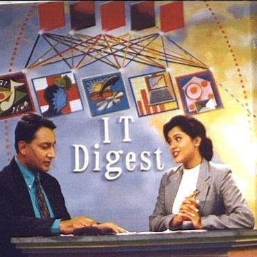 Two news anchors in a studio with colorful backdrop reading 'IT Digest'.