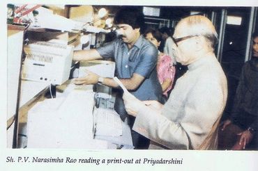 P.V. Narasimha Rao reading a printout at Priyadarshini office.