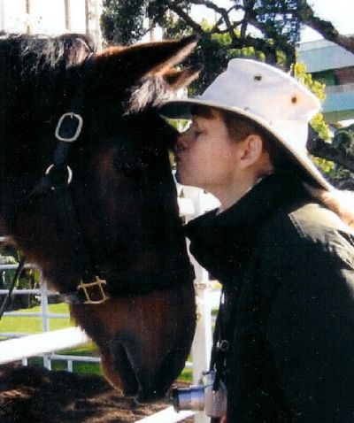 Fred, the horse who played Seabiscuit in the 2003 film, and Karen S Davis at Santa Anita.