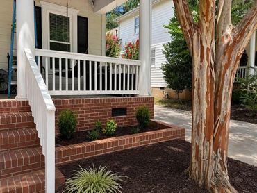 New brick raised planter wall wrapping a porch with brick steps, Richmond VA – after