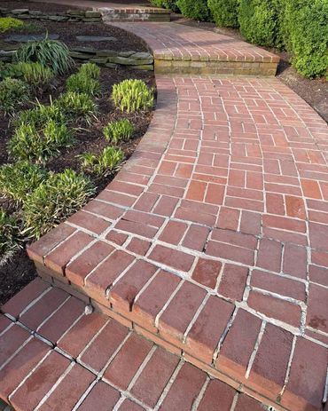 Curved brick walkway with worn mortar joints, Richmond VA – before