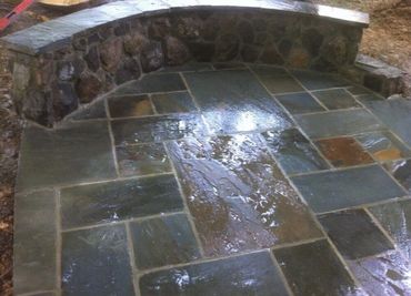 Flagstone patio with a curved fieldstone seat wall, Richmond VA