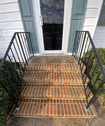 Brick entry steps with freshly repointed rowlock treads and iron railings, Richmond VA