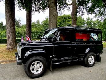 The Landrover hearse proudly bearing our Veteran at his funeral service, led by Tim.