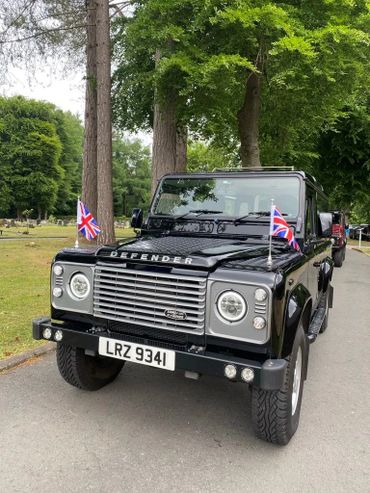 The Landrover hearse at Veteran's funeral, led by Tim