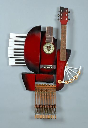 Artist dixon bergman mixes found objects in his 3D sculptures of guitar and piano combinations
