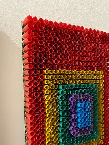 pride artwork uses hunter's spent shotgun shells for 3D assemblage