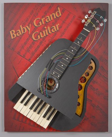 Interactive wall hanging sculpture is made of found piano parts, acoustic guitar parts, electric wir
