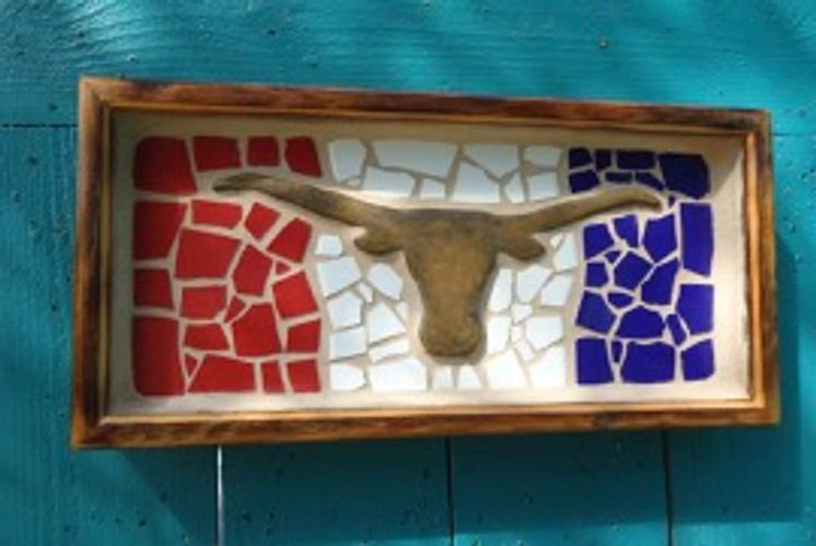 Ceramic fired longhorn is set in red, white, and blue mosaic tile and sand grouted in cedar frame.
