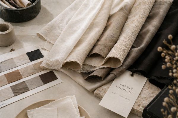 Various fabric samples and color swatches arranged on a table.
