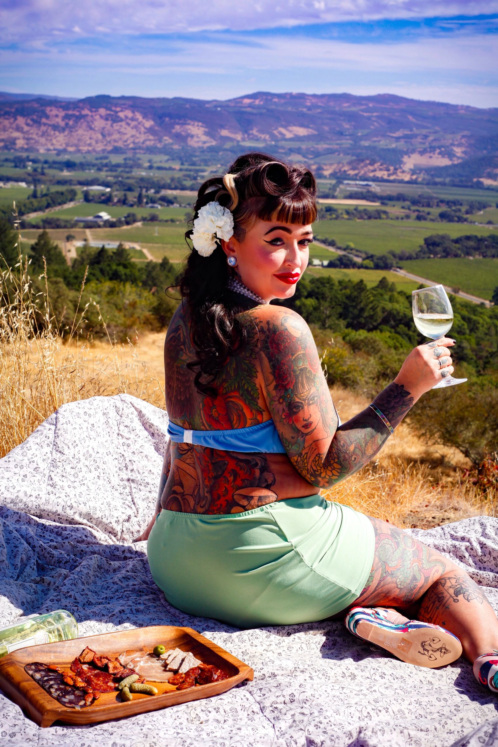 Kayla Van Dyke - Owner of The Hive Salon sipping wine on the hillside overlooking Napa Valley