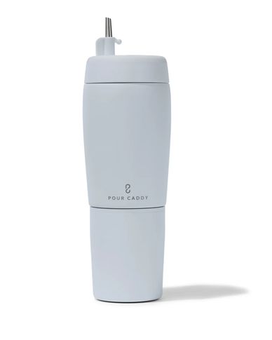 Sleek white Pour Caddy bottle with a straw and minimalist design.