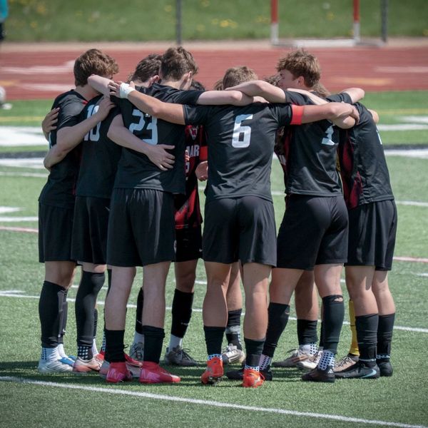 Soccer players in a huddle