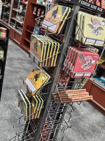 Display rack with premium handmade rolling papers in a store.